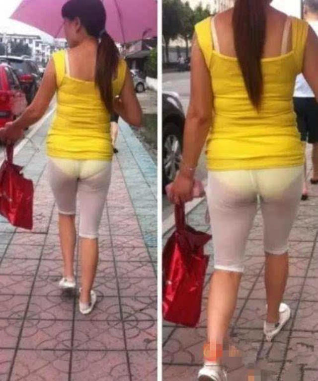 这位大姐是多钟爱黄色,穿这么透视的裤子,非要露出黄色的内裤.