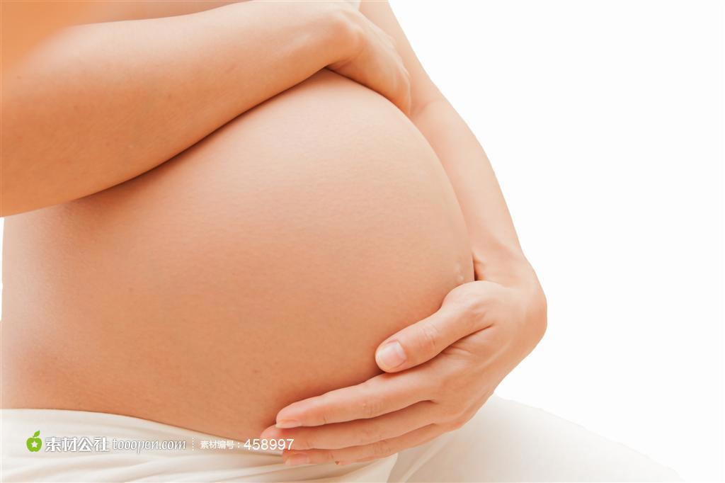 抚摸大肚子的孕妇局部摄影高清图片